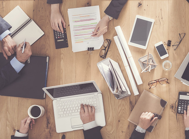 Premium Features pricing (picture showing a planning meeting))